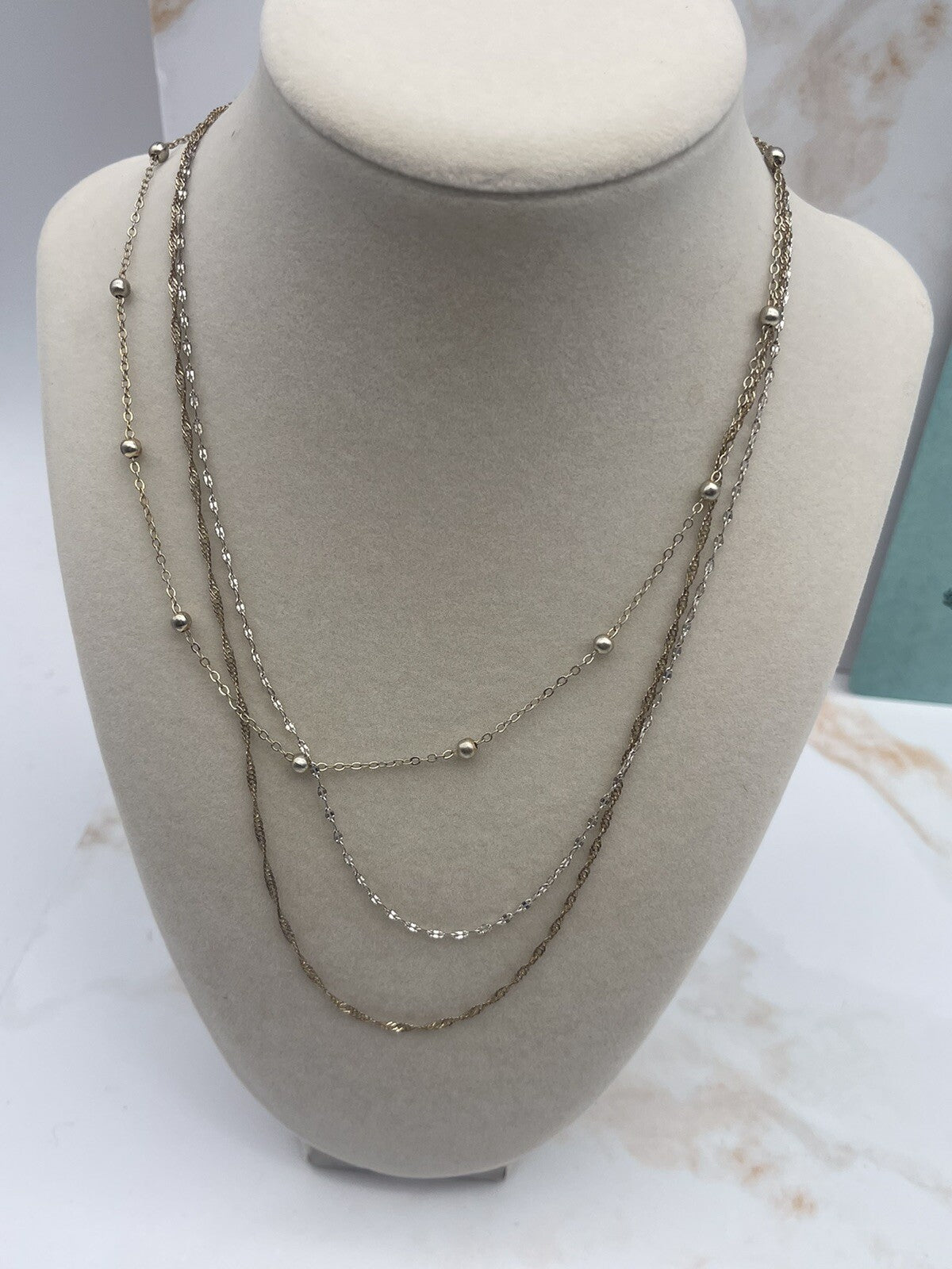And Now This 18K gold over brass 3 style chain layered necklace