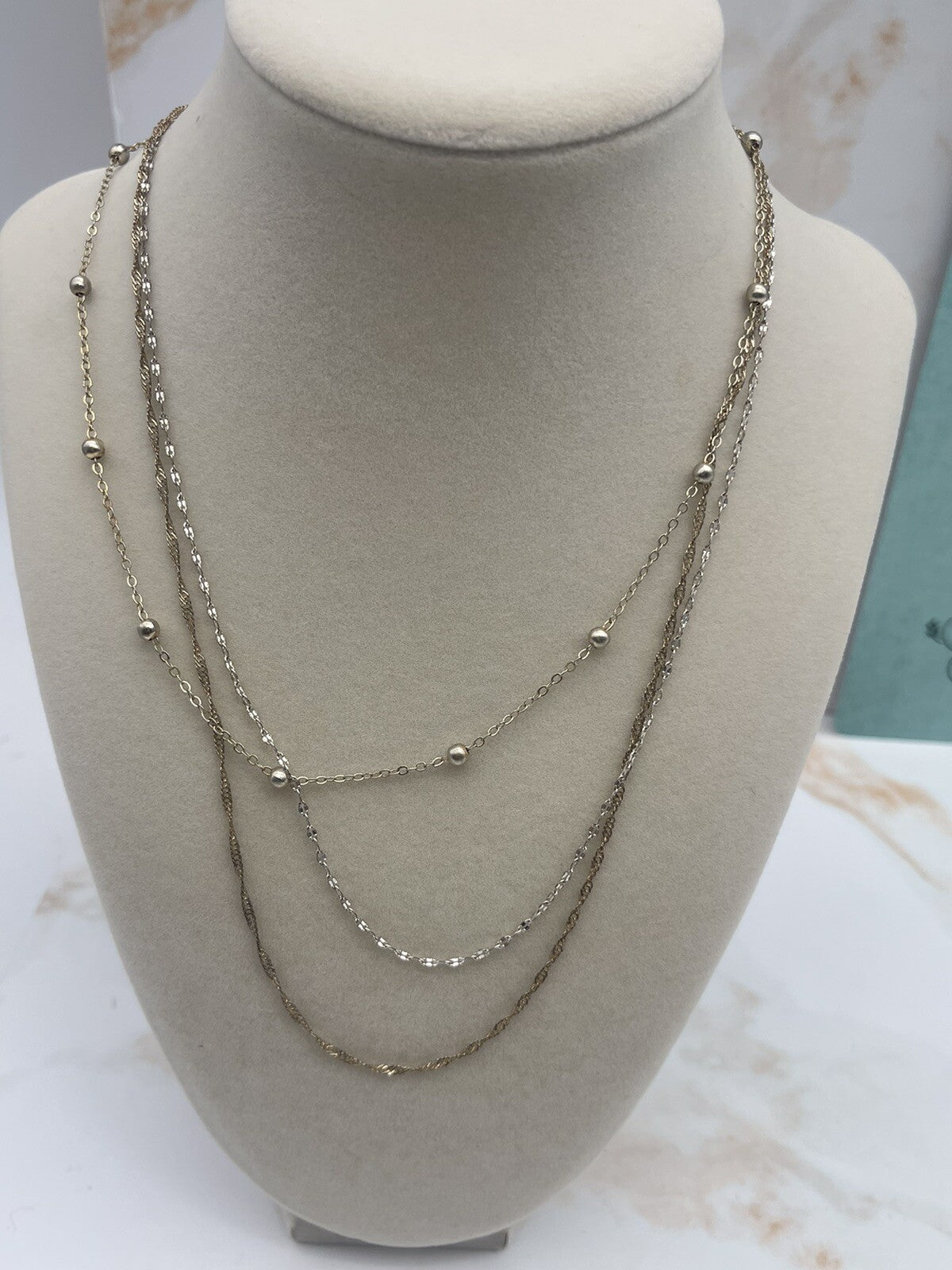 And Now This 18K gold over brass 3 style chain layered necklace