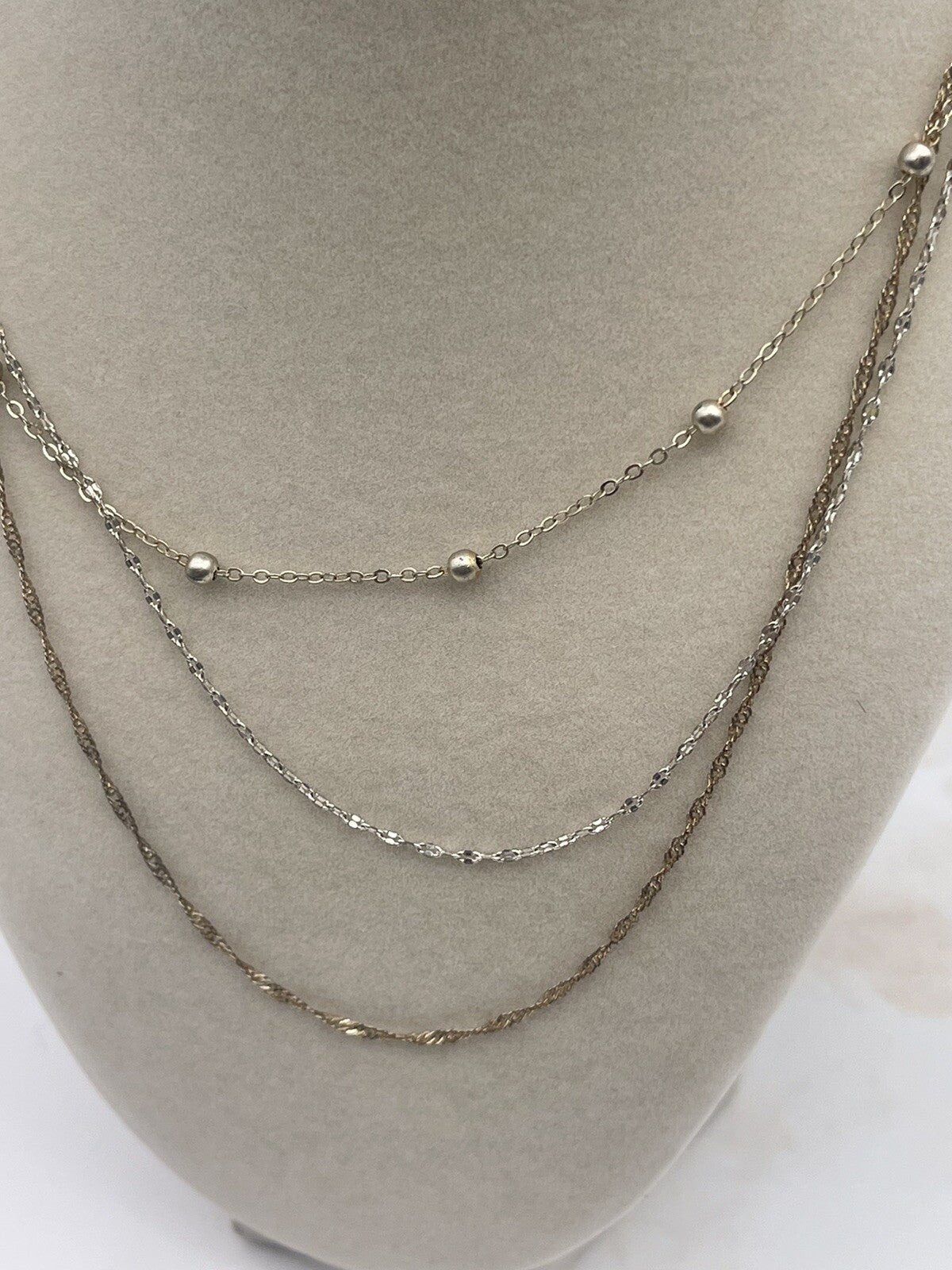 And Now This 18K gold over brass 3 style chain layered necklace