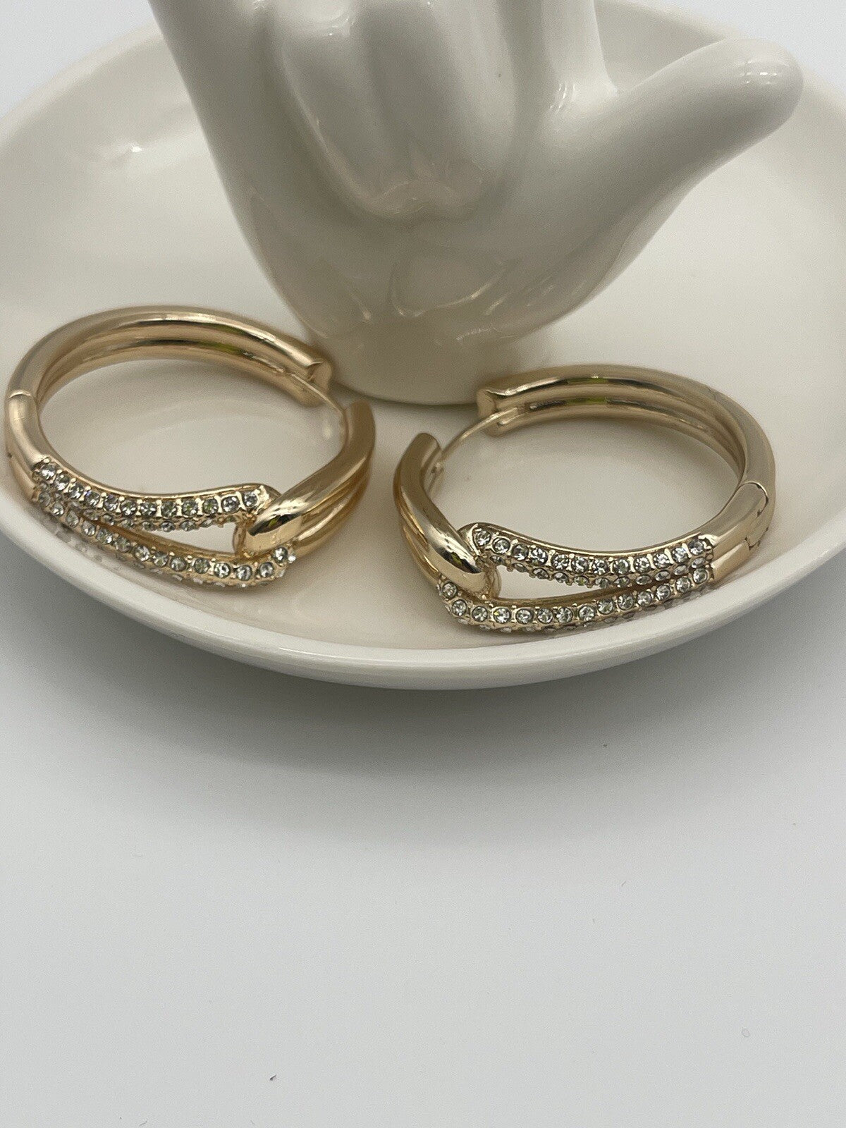 And Now This 18k gold over brass Crystal Knot Hoop Earrings 1 1/4"